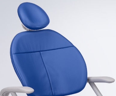 A Pacific blue A-dec 300 dental chair sits on a white background.