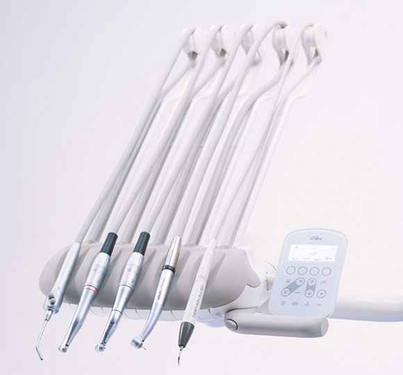An A-dec 300 Pro dental delivery system with an A-dec+ enabled CP5i control pad sit on a white background.